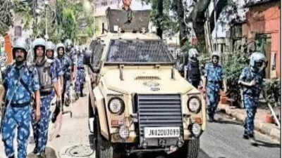 an armoured vehicle and capf personnel on patrol in kolkata tuesday