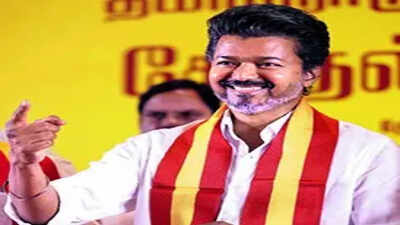 vijay joins freebie bandwagon cash health cover lpg