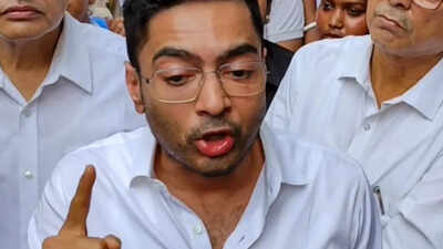 guards scuffle with police as officials remove billboard from abhishek bannerjees kolkata office