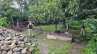 security personnel during a raid in anantnag