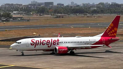 a spicejet passenger aircraft taxis on the tarmac at chhatrapati shivaji international airport in mumbai