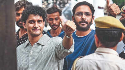 cjp members saurav das and ashutosh ranka arrive at a police station
