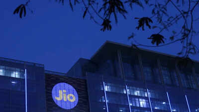 reliance industries jio telecoms logo is displayed on the jio world convention centre building on a street in mumbai